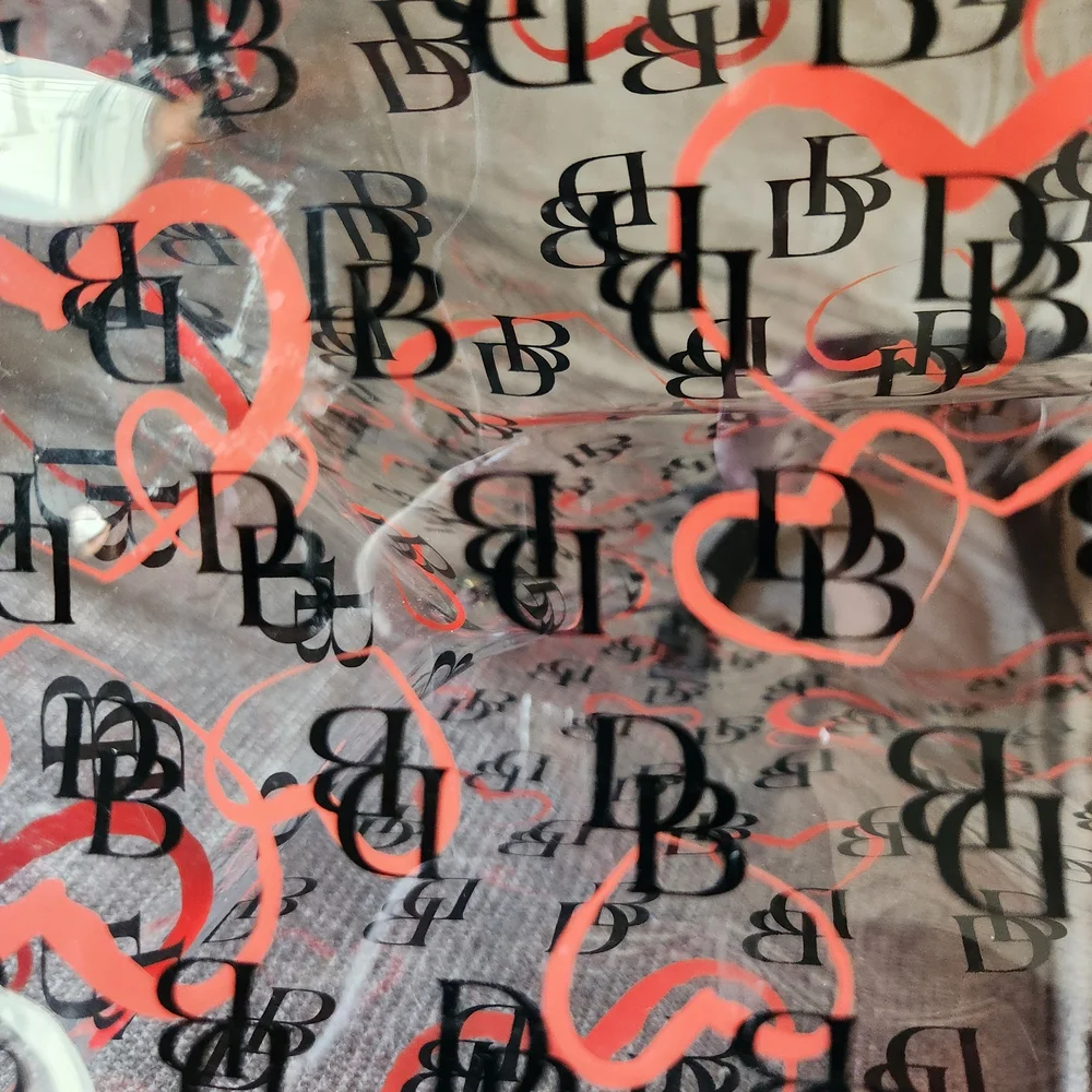 Dooney & Bourke Clear PVC Tote and Zip Pouch with Orange Heart Print - Picture 3 of 10